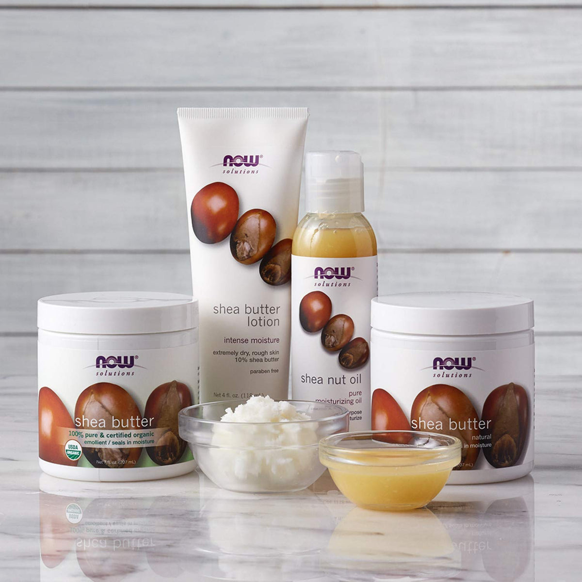 NOW Foods shea butter label close-up highlighting 100% pure and GMP quality