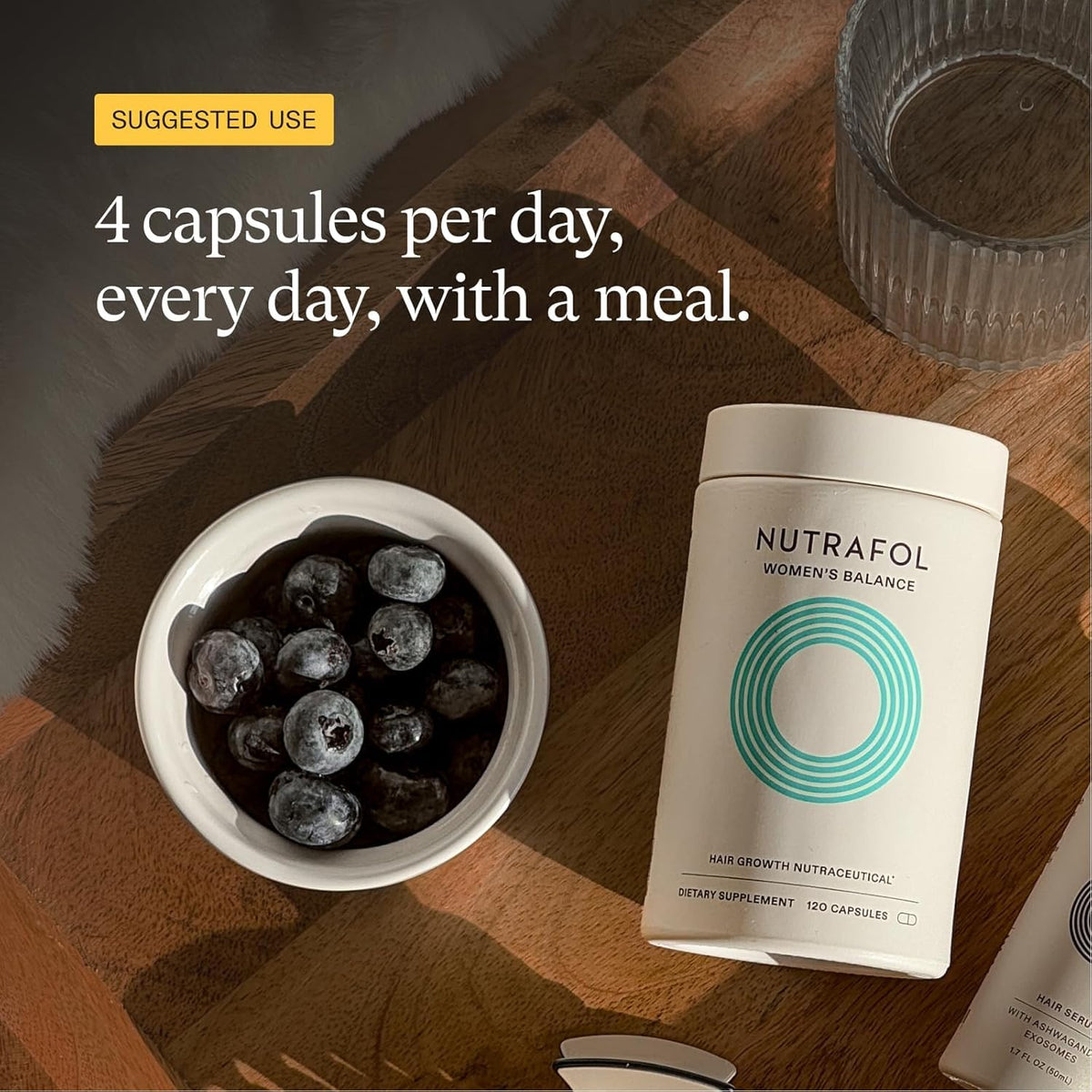 Nutrafol bottle on bathroom shelf suggesting daily supplement routine