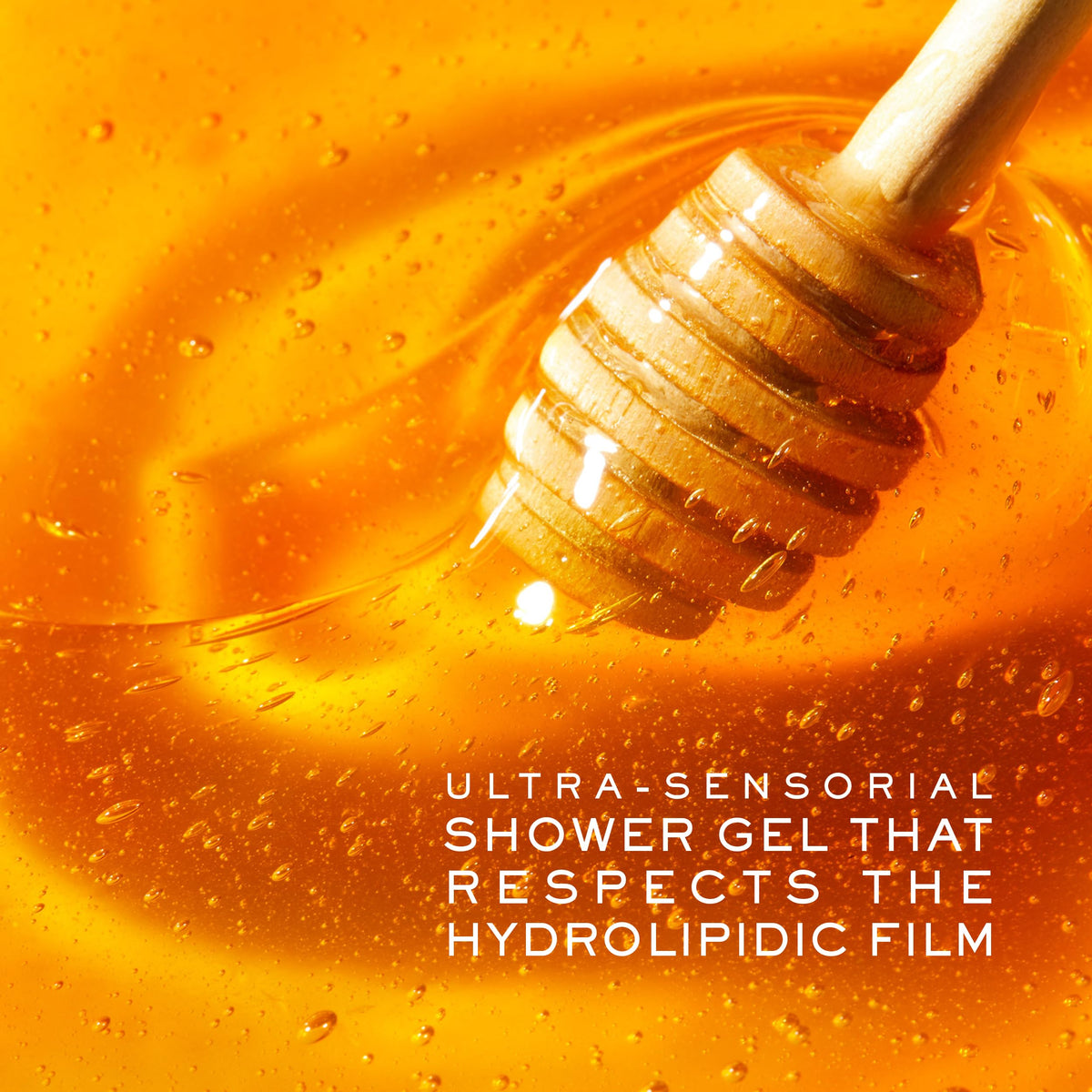 NUXE bottle by bathtub in warm setting suggesting relaxing, hydrating shower