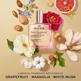 NUXE bottle next to ruler size comparison showing the 3.3 fl oz travel-friendly volume benefit