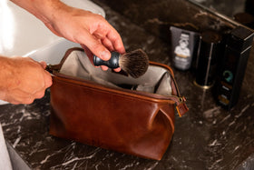 NV Holders size comparison next to toiletries illustrating compact capacity