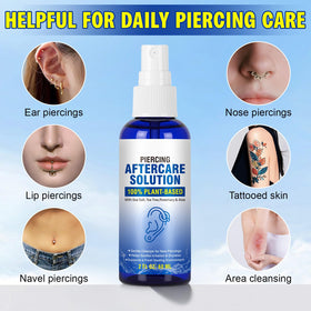 Applying Nyloriaine to ear piercing for gentle daily cleansing