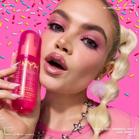 NYX PROFESSIONAL MAKEUP bottle in hand for scale showing portable 2.7 fl oz convenience