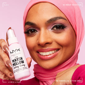 NYX PROFESSIONAL MAKEUP model applying spray showing fresh matte finish benefit