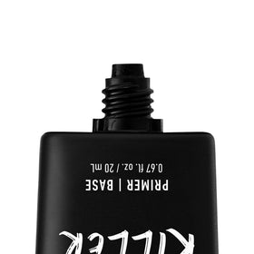 NYX PROFESSIONAL MAKEUP bottle beside coin for scale to show travel-friendly size