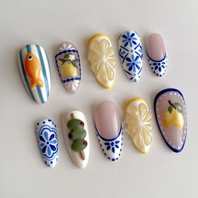 NZRAESTRS front packaging showing 24-piece summer press-on nail set and designs