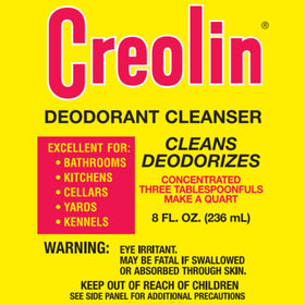 OAKHURST Creolin being poured into measuring spoon, illustrates dilution benefit