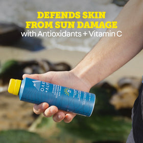 Oars + Alps spray mist on skin showing quick absorption and light feel