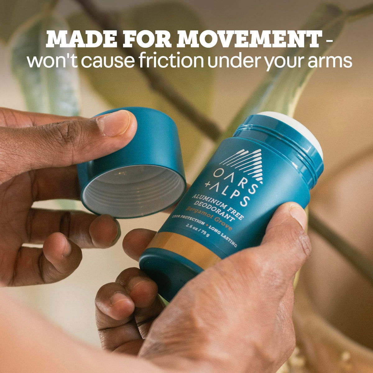 Oars + Alps applying clear deodorant on underarm demonstrating non-sticky protection and comfort