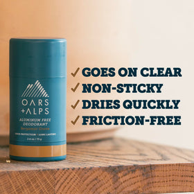 Oars + Alps deodorant next to light shirt illustrating no white marks or pit stains benefit