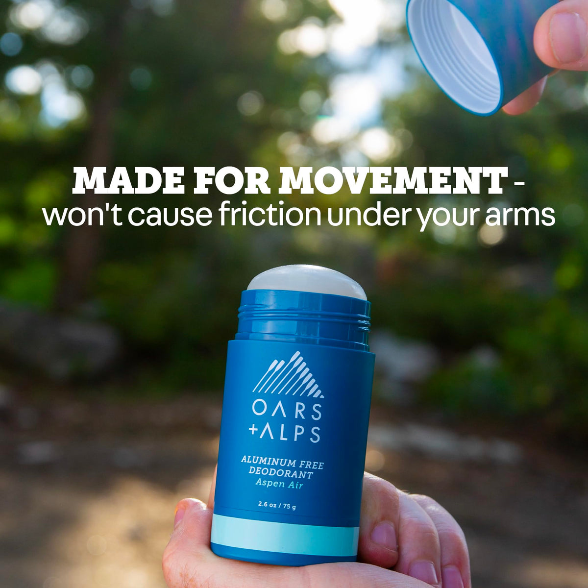 Oars + Alps deodorant held in hand showing compact 2.6oz size