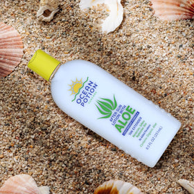 Ocean Potion bottle in a beach bag lifestyle shot suggesting travel-ready after-sun care