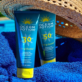 Ocean Potion bottle in hand to show compact 3.4 oz travel size