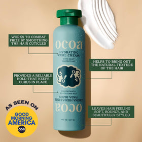 OCOA cream texture scooped on finger showing rich, spreadable hydration