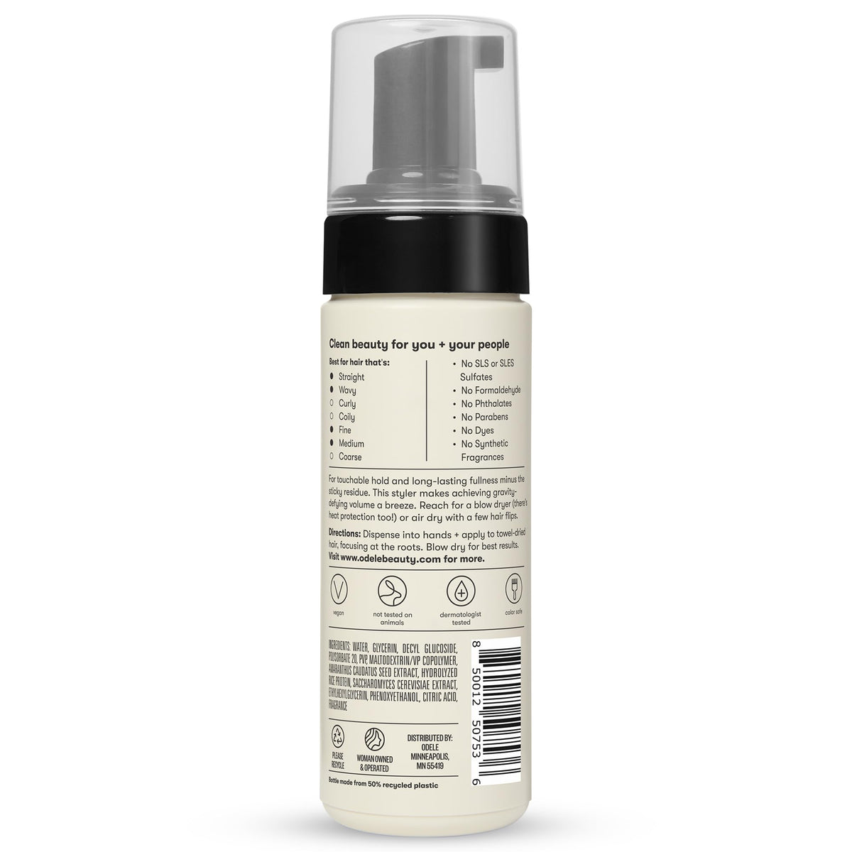 Odele 5 fl oz bottle next to hand for scale, illustrating compact travel-ready size