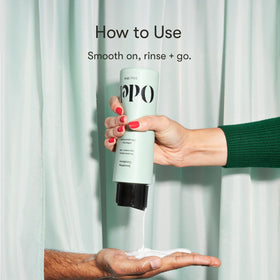 Odele bottle beside measuring cup showing 13 fl oz scale and value