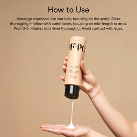 Odele set in hand size comparison illustrating travel-friendly 13 fl oz bottles
