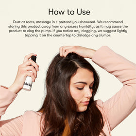 Odele powder blended into dark hair demonstrating invisible finish advantage