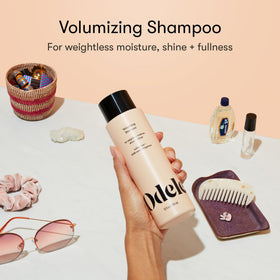 Odele shampoo pouring from bottle, texture close-up showing lightweight foaming action