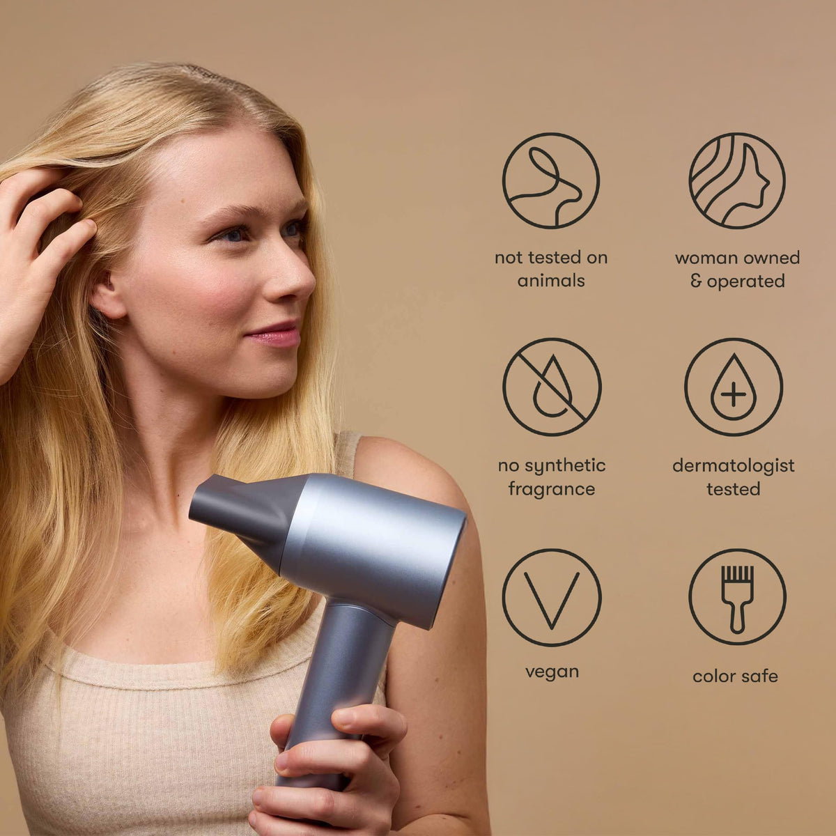 Odele being applied while blow-drying to show heat protection benefit during styling