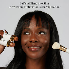 Ogee brush applying foundation to cheek for seamless, airbrushed finish