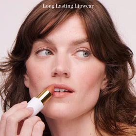Ogee Lulu lip application on model showing full-coverage pink matte finish