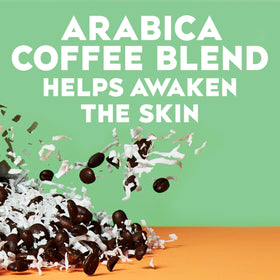 OGX person applying coconut coffee scrub in shower to exfoliate and hydrate skin