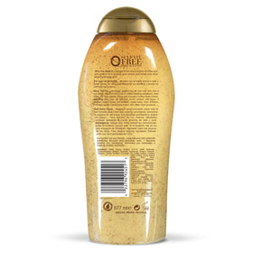 OGX scrub bottle beside body cream in a bathroom scene for enhanced daily moisture