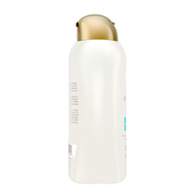 OGX coconut ingredient close-up highlighting natural oil for shine