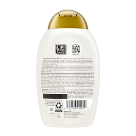 OGX bottle styled on bathroom shelf showing lifestyle aesthetic benefit