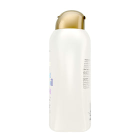 OGX conditioner being applied to hair in hand for improved manageability