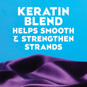 OGX creamy conditioner texture close-up demonstrating smooth slip