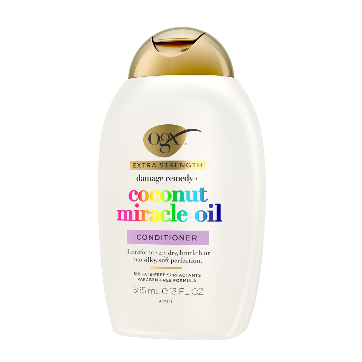 OGX 13 fl oz bottle beside common items to show size and portability