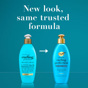 OGX curl cream in hand demonstrating amount and even application for defined curls