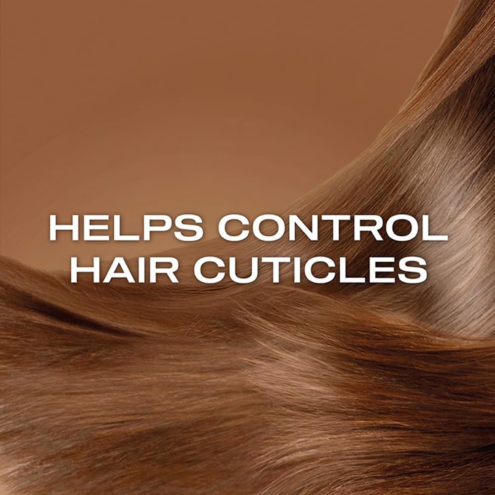 OGX shampoo in shower being applied to hair showing practical use and frizz-control benefit