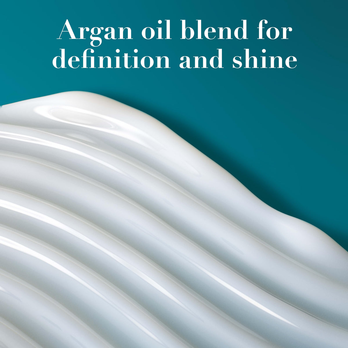 OGX cream staged on bathroom counter to show daily styling routine convenience
