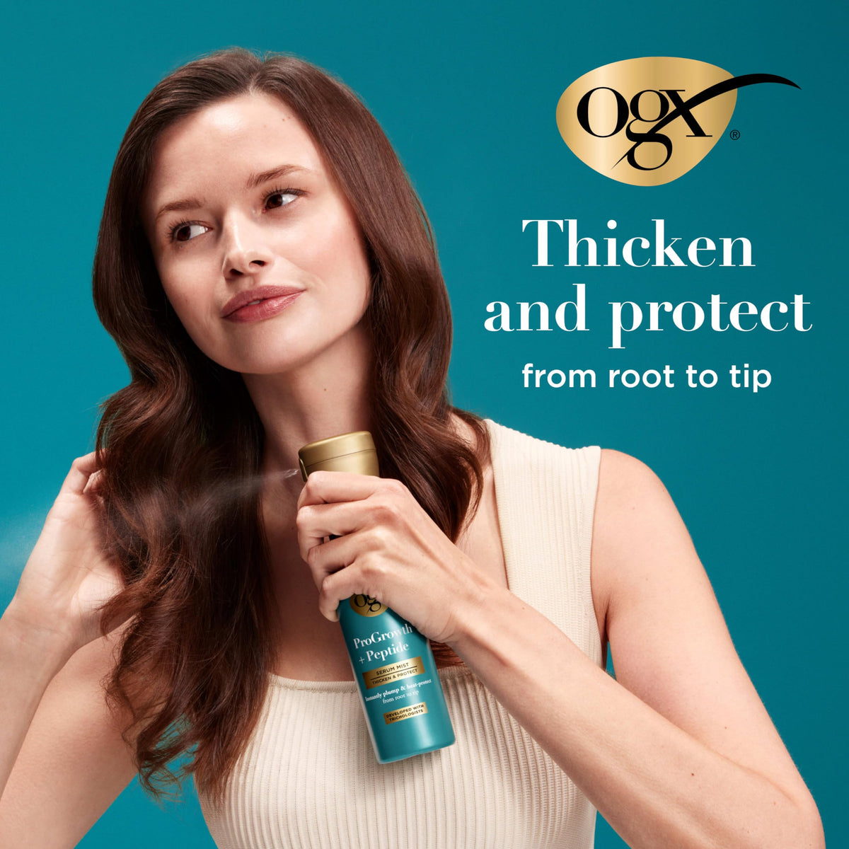 OGX mist applied to damp hair for root-to-tip thickness and protection