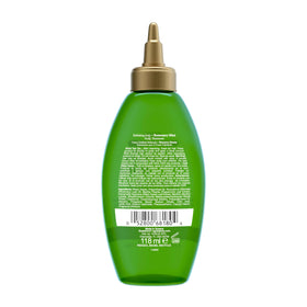 OGX bottle on bathroom shelf with mint and rosemary for fresh routine
