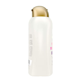 OGX shampoo staged in bathroom shelf, conveys daily routine benefit