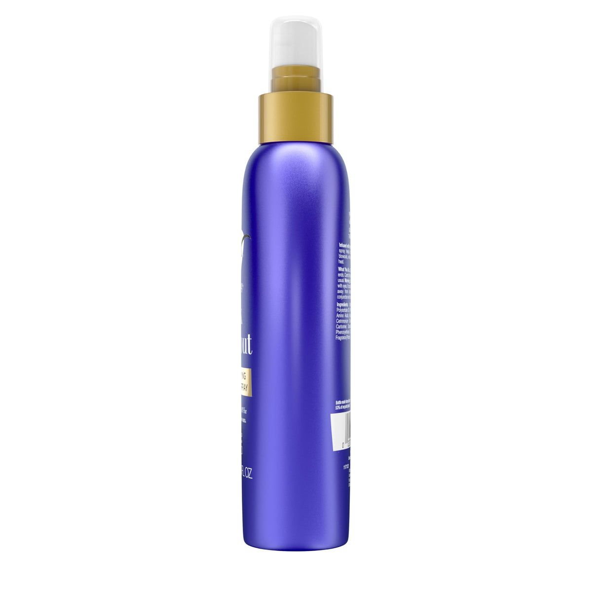 Model using OGX spray while blow-drying for smoother, shinier hair