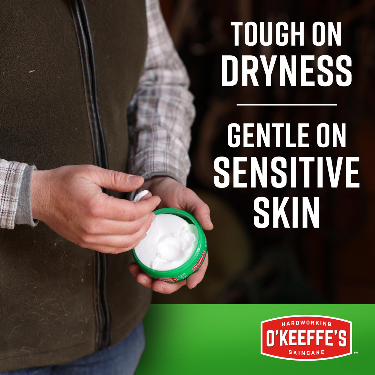 O'Keeffe's applying cream to cracked hands for fast relief
