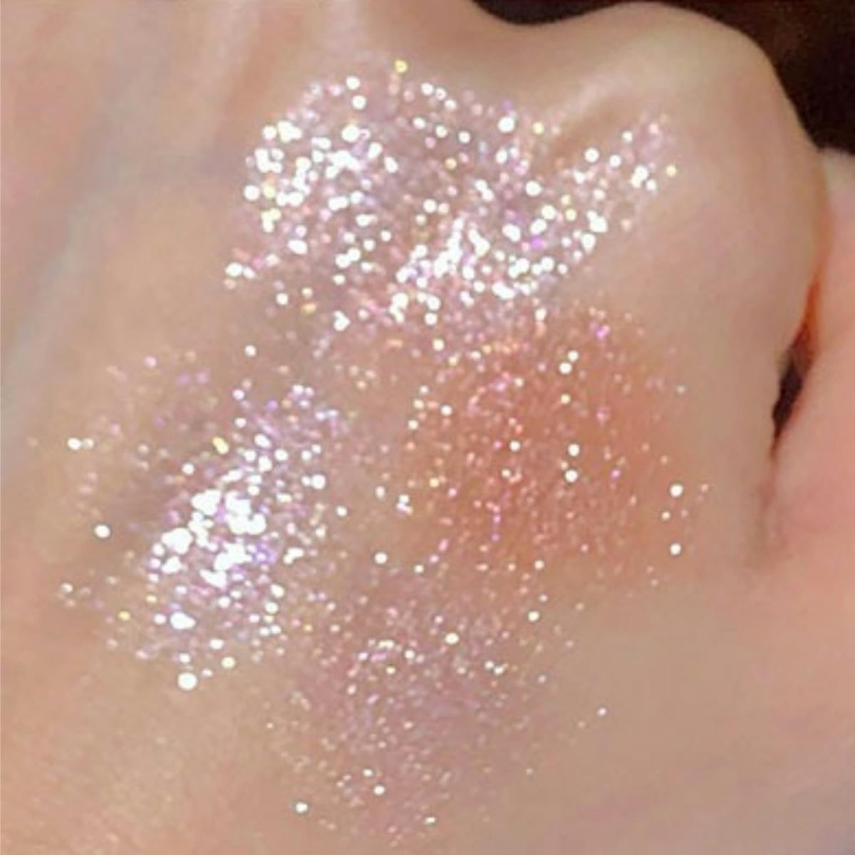 Okerker eyeshadow applied on model eye to show real-life sparkle effect