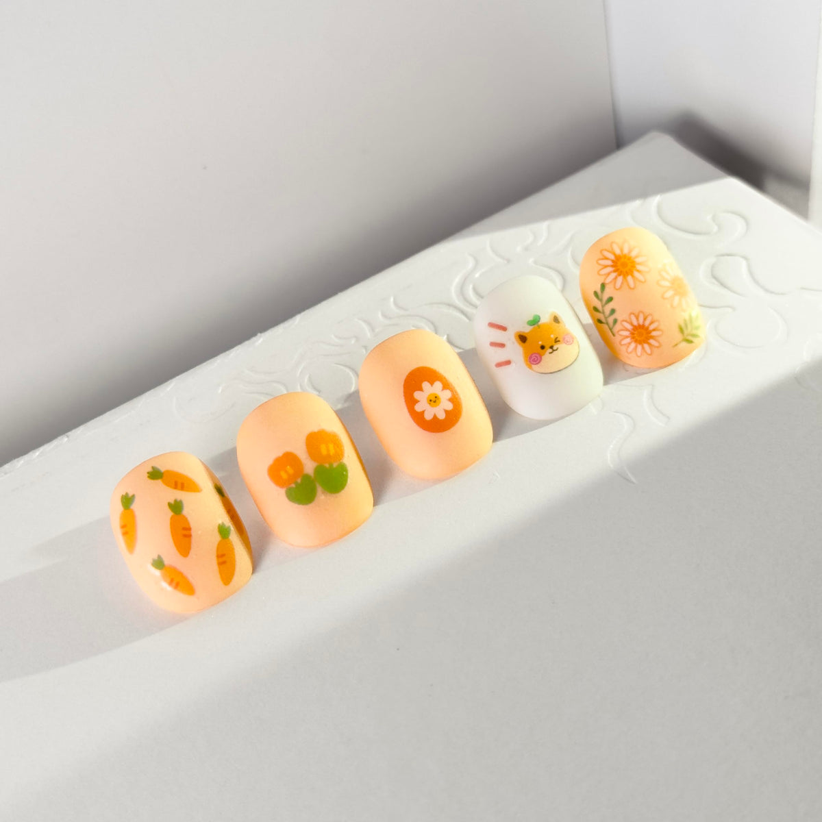 okiyomi peeled decal being placed on a nail showing simple one-step application