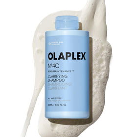 Olaplex bottle front view showing clean design and product name benefits