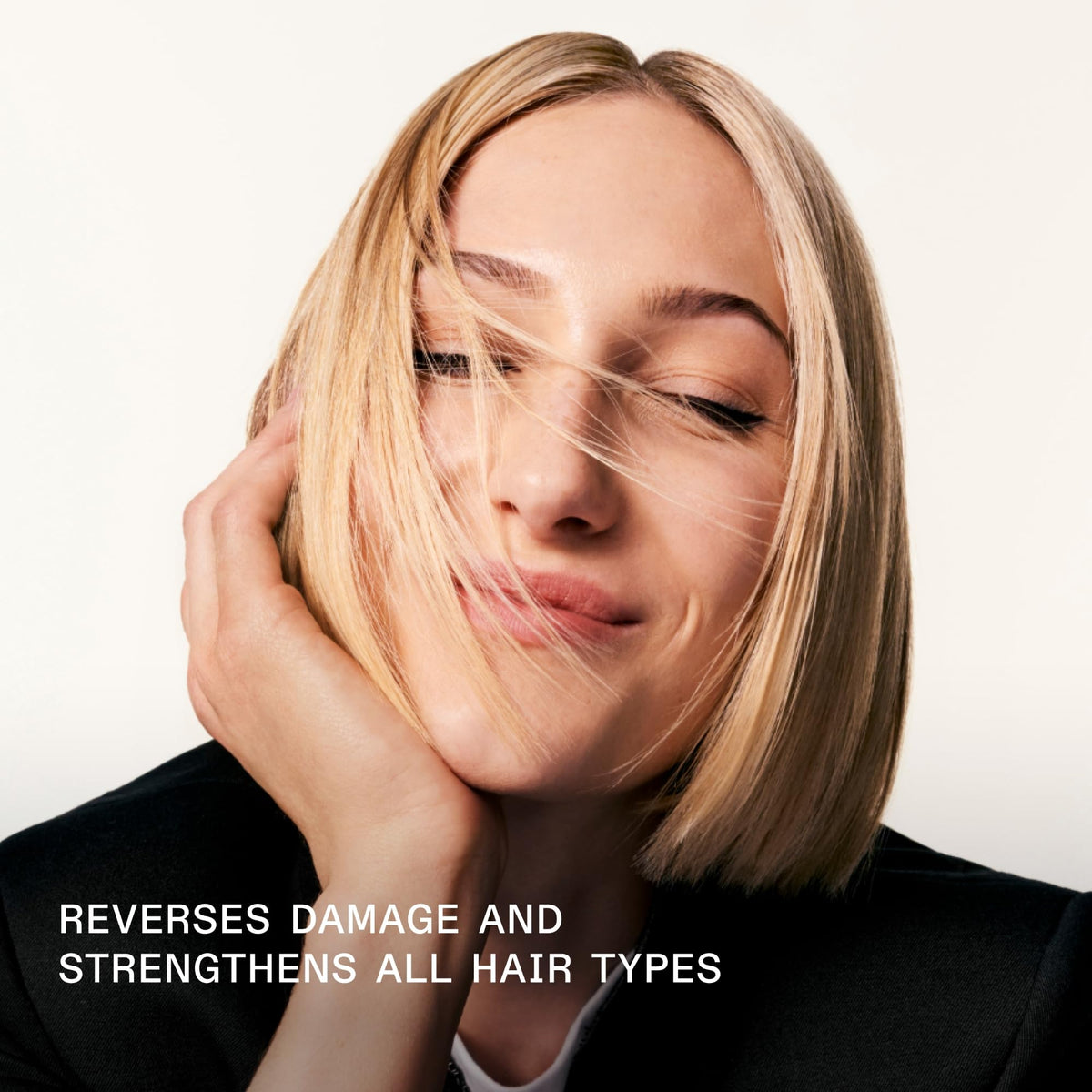 Applying Olaplex No.3 to damp hair to show repair action and improved manageability