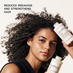 Close-up of Olaplex No.4 and No.5 labels showing bond maintenance benefits and ingredient focus