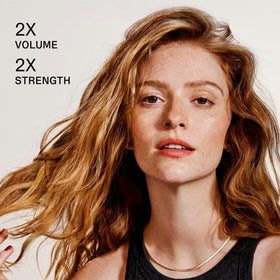 Olaplex brand bottle label close-up highlighting product name and usage benefits