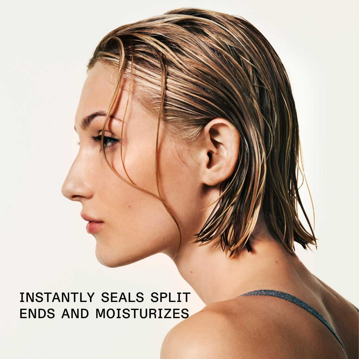 Applying Olaplex Nº.5 to damp hair for easier detangling and softness