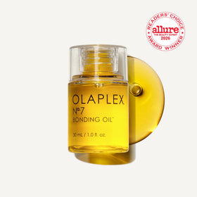 Olaplex No.7 dispensing a single drop from the nozzle highlighting concentrated formula