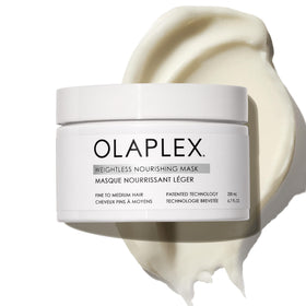 Olaplex front bottle shot showing product label and clear packaging benefit lightweight volume